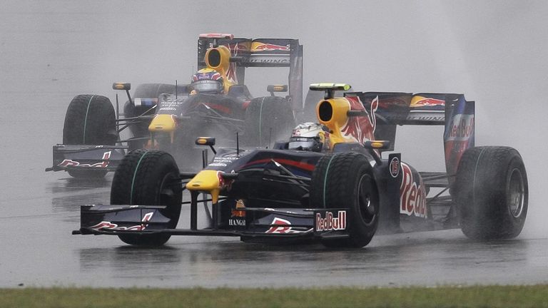Red Bull Formula One driver Sebastian Vettel of Germany leads Red Bull team mate Mark Webber of Australia as they follow the safety car early in the Chinese Formula One Grand Prix at the Shanghai International Circuit in Shanghai, China, Sunday April 19, 2009. (AP Photo/Greg Baker)