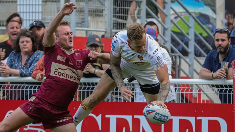 Tom Johnstone scored twice as Catalans Dragons moved two points clear at the top of the Super League table