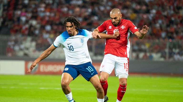 England&#39;s Trent Alexander Arnold , left, challenges for the ball with Malta&#39;s Teddy Teuma during the Euro 2024 group C qualifying soccer match between Malta and England at the National stadium in Ta&#39; Qali, near Valletta, Malta, Friday, June 16, 2023. (AP Photo/Rene Rossignaud)