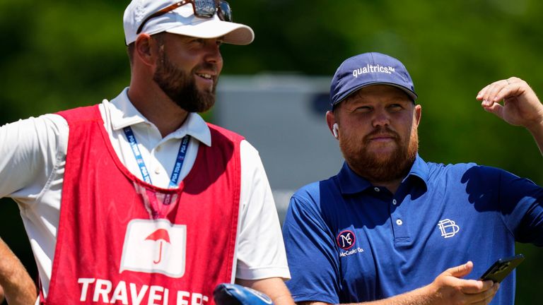 Zac Blair speaks with his caddie on the first tee during the final round of the Travelers Championship golf tournament at TPC River Highlands, Sunday, June 25, 2023, in Cromwell Conn. (AP Photo/Frank Franklin II)