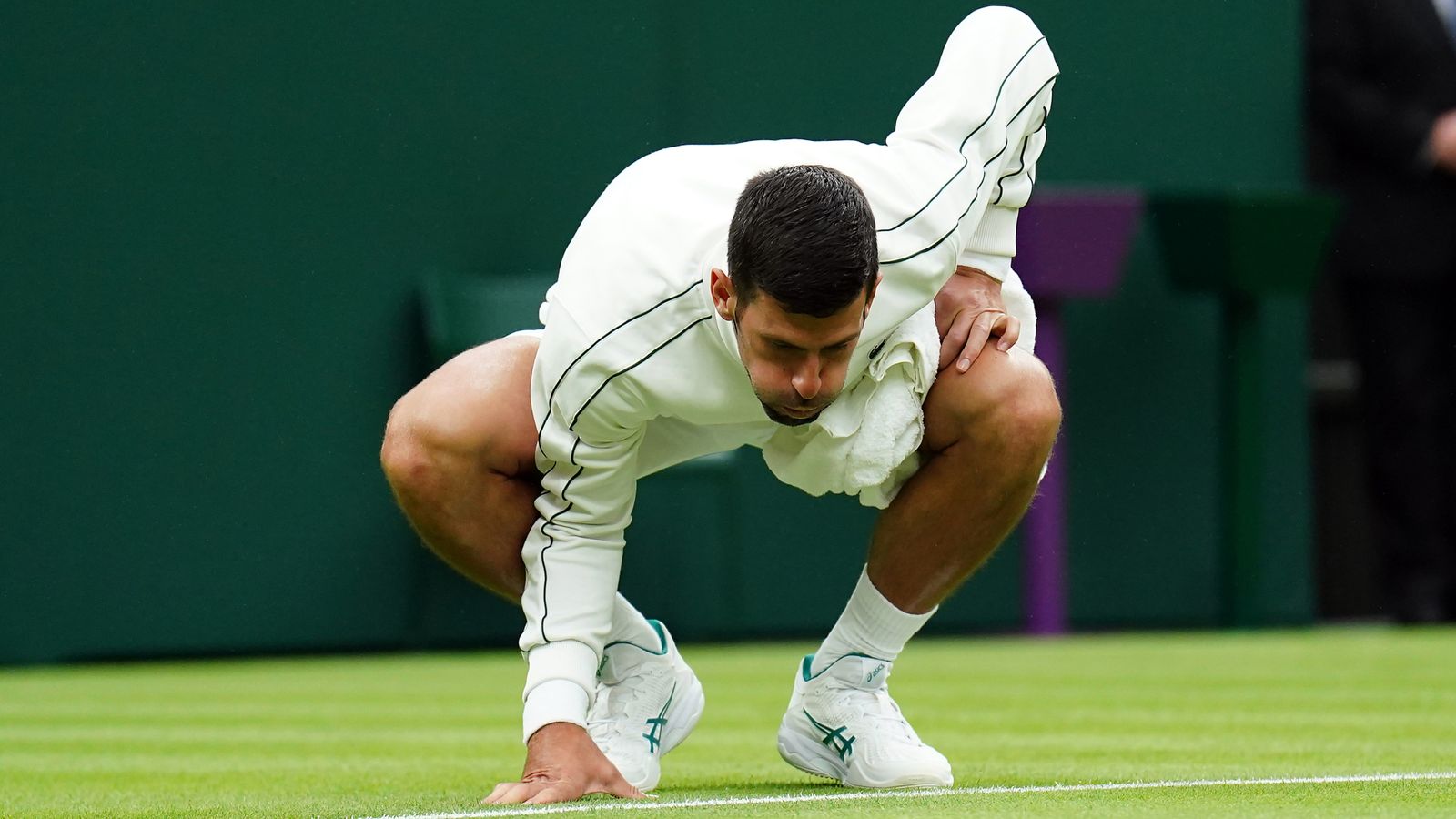 Wimbledon: Novak Djokovic uses towel to dry Centre Court as fans ...