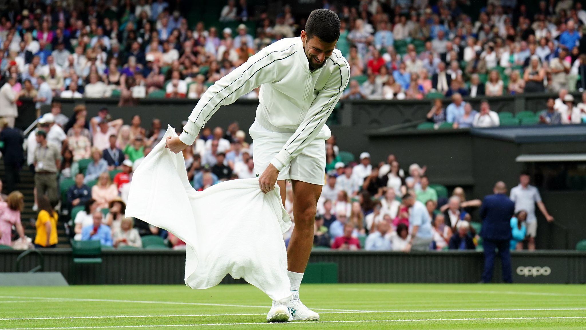 Wimbledon Novak Djokovic uses towel to dry Centre Court as fans witness farcical rain delay Tennis News Sky Sports
