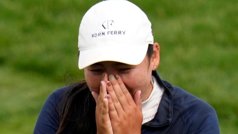 Allisen Corpuz covers her face on the 18th green after winning the U.S. Women's Open golf tournament at the Pebble Beach Golf Links, Sunday, July 9, 2023, in Pebble Beach, Calif. (AP Photo/Godofredo A. V..squez)