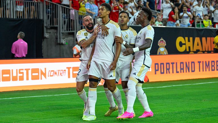 HOUSTON, TX - JULY 26: Real Madrid defender Jude Bellingham (5) is congratulated by teammates after scoring a first half goal during the Soccer Champions Tour match between Real Madrid and Manchester United at NRG Stadium on July 26, 2023 in Houston, Texas. (Photo by Ken Murray/Icon Sportswire) (Icon Sportswire via AP Images)