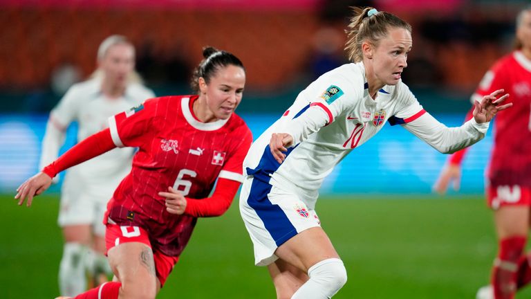 Norway's Caroline Graham Hansen, right, plays the ball next to Switzerland's Geraldine Reuteler