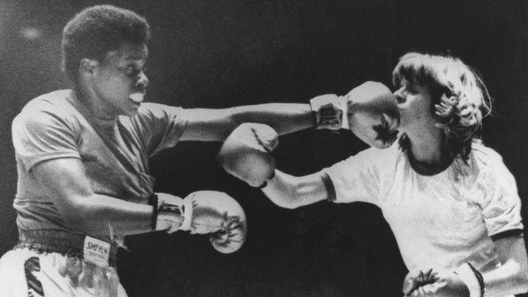 Gwen Gemini, left, unleashes a left to the head of Cat Davis during a women&#39;s pro boxing match in Portland, Maine, Feb. 27, 1976. The women&#39;s bouts have swelled the turnout of the local fight cards. (AP Photo)