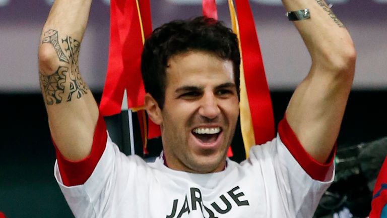 Spain's Cesc Fabregas holds up the trophy at the end of during the Euro 2012 soccer championship final  between Spain and Italy in Kiev, Ukraine, Sunday, July 1, 2012. Spain won 4-0. (AP Photo/Jon Super) 