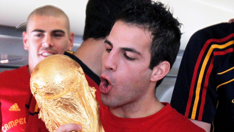 Fabregas celebrates with the World Cup trophy in 2010 after the tournament in South Africa