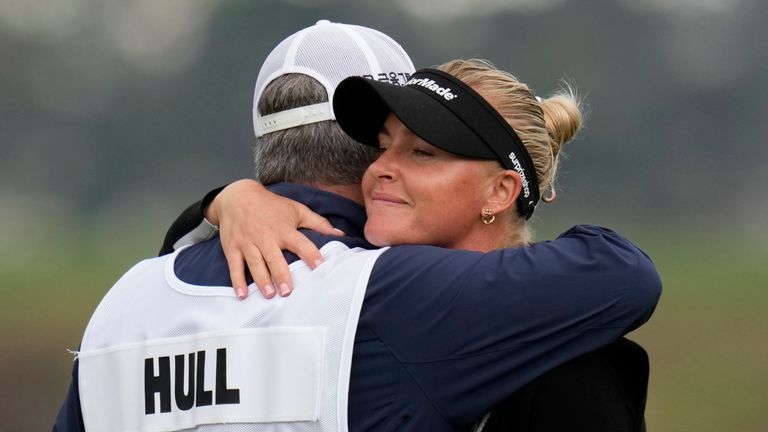 Charley Hull, of England, hugs her caddie after finishing on the 18th green during the final round of the U.S. Women's Open golf tournament at the Pebble Beach Golf Links, Sunday, July 9, 2023, in Pebble Beach, Calif. (AP Photo/Godofredo A. V..squez)