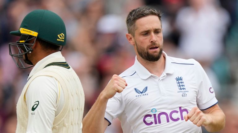 England's Chris Woakes celebrates dismissing Australia's Usman Khawaja, left, on day five of the fifth Ashes Test match between England and Australia, at The Oval cricket ground in London, Monday, July 31, 2023. (AP Photo/Kirsty Wigglesworth)