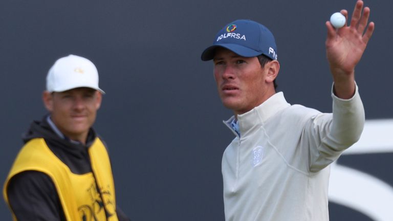 South Africa's Christo Lamprecht (amateur) acknowledges the crowd after a birdie putt on the 18th green on the first day of the British Open Golf Championships at the Royal Liverpool Golf Club in Hoylake, England, Thursday, July 20, 2023. (AP Photo/Peter Morrison)