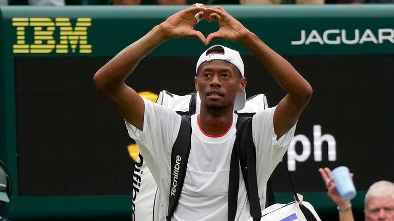 Christopher Eubanks of the US gestures to the crowd after losing to Russia's Daniil Medvedev in their men's singles match at the 2023 Wimbledon Championships