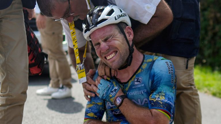 Britain's Mark Cavendish receives medical assistance after crashing during the eighth stage of the 2023 Tour de France  (AP)