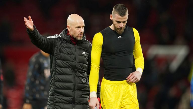 Manchester United's head coach Erik ten Hag, left, and Manchester United's goalkeeper David de Gea talk after the English Premier League soccer match between Manchester United and Bournemouth at Old Trafford in Manchester, England, Tuesday, Jan. 3, 2023. (AP Photo/Dave Thompson)