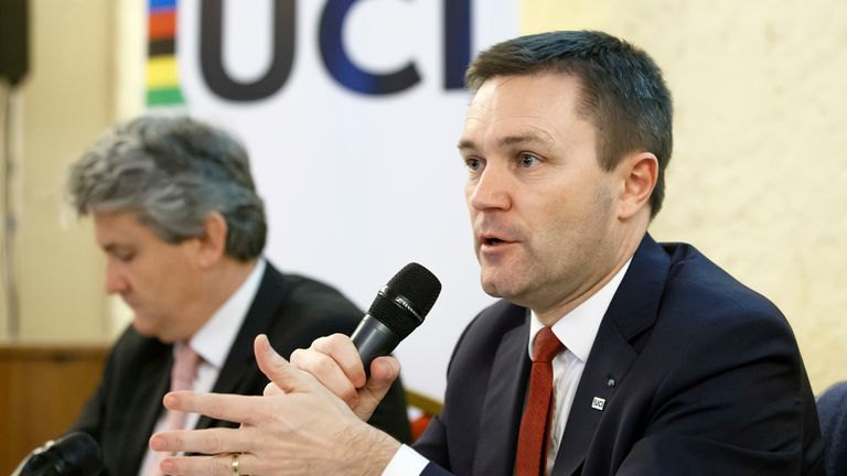 FILE - UCI President David Lappartient, right, speaks to the media about the fight against technological fraud during a press conference in Geneva, Switzerland, Wednesday, March 21, 2018. Female transgender athletes who transitioned after male puberty will no longer be able to compete in women's races, world cycling governing body the UCI said Friday, July 14, 2023. 