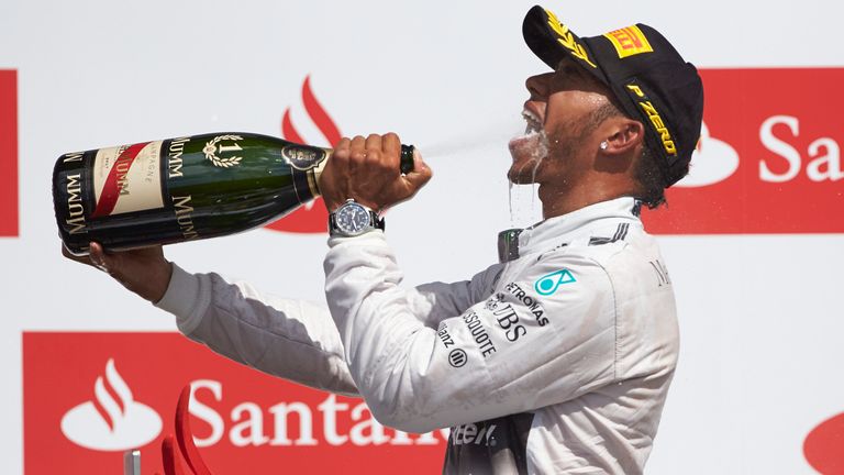 Lewis Hamilton celebrates his 2014 British GP win on the podium