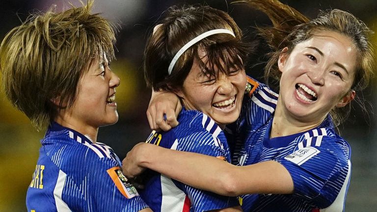 Hinata Miyazawa (2nd from L) of Japan celebrates with teammates after scoring her team's third goal in the first half of a Women's World Cup Group C football match against Spain at Wellington Regional Stadium in Wellington,