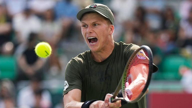 Jenson Brooksby, of the United States, hits a return to Denis Shapovalov, of Canada, at the Korea Open tennis tournament in Seoul, South Korea, Oct. 1, 2022. Brooksby tells The Associated Press he has accepted a provisional suspension from the International Tennis Integrity Agency after being accused of missing three doping tests in a 12-month period. Brooksby plans to go to arbitration. (AP Photo/Lee Jin-man, File)