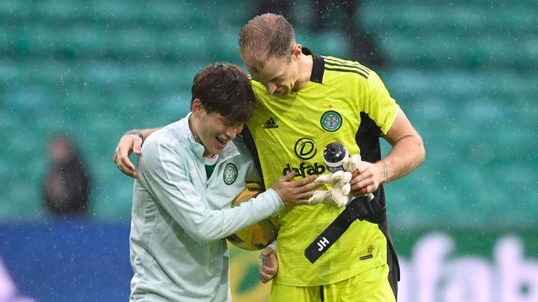 GLASGOW, SCOTLAND - AUGUST 08: Kyogo Furuhashi (L) and Joe Hart at full time during a cinch Premiership match between Celtic and Dundee at Celtic Park, on August 08, 2021, in Glasgow, Scotland. (Photo by Rob Casey / SNS Group)