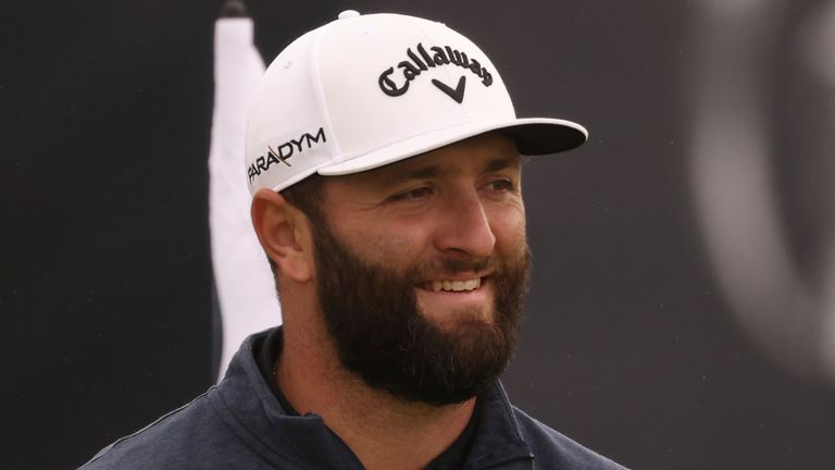 Spain's Jon Rahm smiles after he putts on the 3rd green during a practice round for the British Open Golf Championships at the Royal Liverpool Golf Club in Hoylake, England, Monday, July 17, 2023. The Open starts Thursday, July 20. (AP Photo/Peter Morrison)
