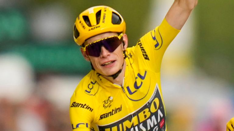 Tour de France winner Denmark's Jonas Vingegaard, wearing the overall leader's yellow jersey, and his teammates cross the finish line of the twenty-first stage of the Tour de France cycling race over 115 kilometers (71.5 miles) with start in Saint-Quentin-en-Yvelines and finish on the Champs-Elysees avenue in Paris, France, Sunday, July 23, 2023. (AP Photo/Thibault Camus)