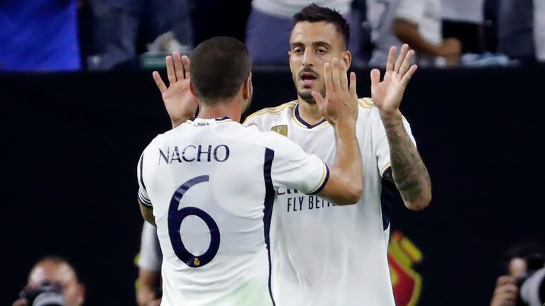 Real Madrid&#39;s Nacho (6) and Joselu, right, celebrate the goal by Joselu against Manchester United during the second half of a Champions Tour friendly soccer match, Wednesday, July 26, 2023, in Houston. (AP Photo/Michael Wyke)