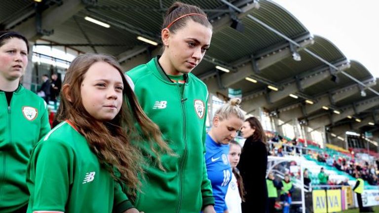 Katie McCabe walks out with her sister, Lauryn, for the Republic of Ireland