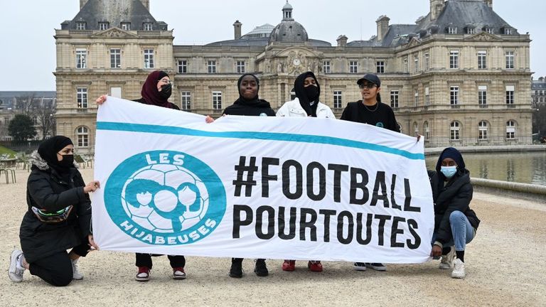 People in France protest against the banning of the hijab in football