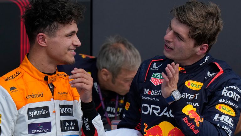 Red Bull driver Max Verstappen of the Netherlands, right, talks to McLaren driver Lando Norris of Britain after the qualifying session at the British Formula One Grand Prix at the Silverstone racetrack, Silverstone, England, Saturday, July 8, 2023. The British Formula One Grand Prix will be held on Sunday. (AP Photo/Luca Bruno)