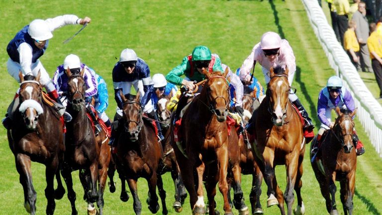Dwyer (pink, right) gets Sir Percy in front in the 2006 Derby at Epsom