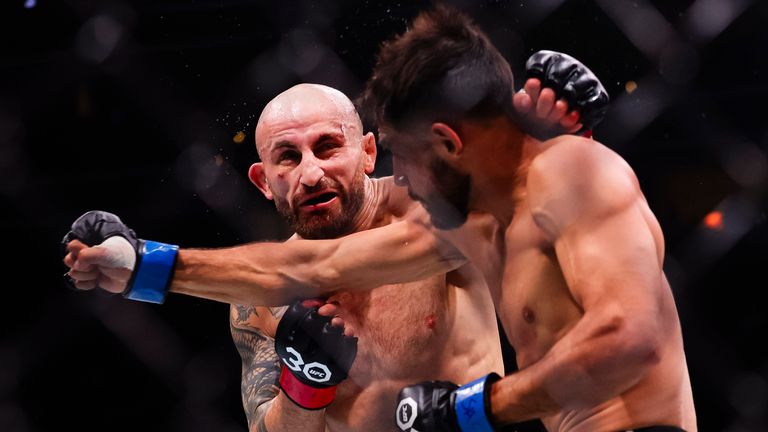 Alexander Volkanovski (L) fights Yair Rodriguez during a featherweight mixed martial arts bout during UFC 290 on Saturday, July 8, 2023, in Las Vegas (AP)