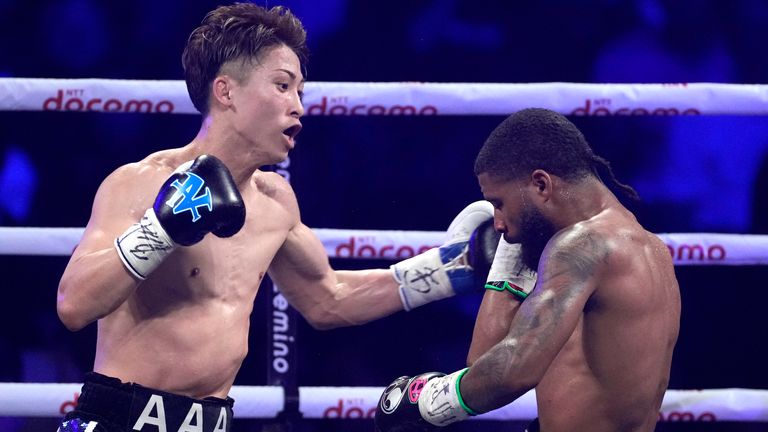Naoya Inoue, left, of Japan throws a punch against Stephen Fulton of the U.S., during the round four of a boxing match for the unified WBC and WBO super-bantamweight world titles in Tokyo, Tuesday, July 25, 2023. (AP Photo/Hiro Komae)