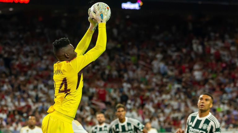 HOUSTON, TX - JULY 26: Manchester United goalkeeper Andre Onana (24) leaps to grab the ball out of the air during the Soccer Champions Tour match between Real Madrid and Manchester United on July 26, 2023, at NRG Stadium in Houston, TX. (Photo by David Buono/Icon Sportswire) (Icon Sportswire via AP Images)