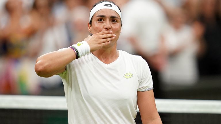Ons Jabeur celebrates victory over Aryna Sabalenka following the Ladies Singles - Semi-Final match on day eleven of the 2023 Wimbledon Championships at the All England Lawn Tennis and Croquet Club in Wimbledon. Picture date: Thursday July 13, 2023.