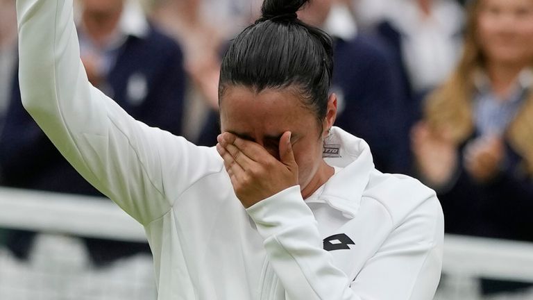 A tearful Jabeur holds her runners-up trophy after losing to Marketa Vondrousova in the Wimbledon final