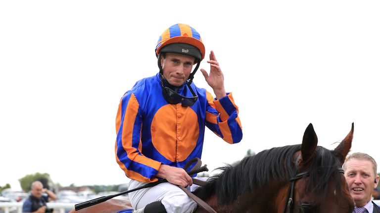 Ryan Moore salutes the Sandown crowd after Paddington's victory