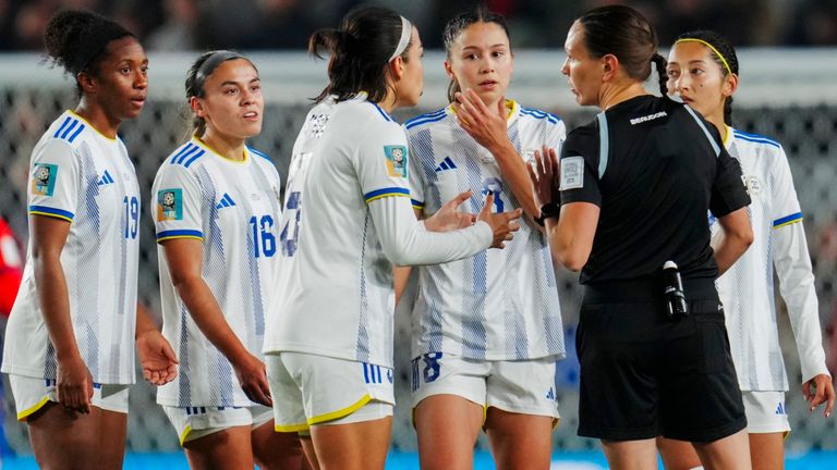 Philippines players talk to Canadian referee Marie-Soleil Beaudoin, right, after Philippines' Sofia Harrison, third left, were shown a red card during the Women's World Cup Group A soccer match between Norway and Philippines at Eden Park stadium in Auckland, New Zealand, Sunday, July 30, 2023. (AP Photo/Abbie Parr)