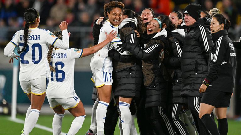 Philippines' Sarina Bolden, centre, is congratulated by teammates after scoring her teams first goal during the Women's World Cup Group A soccer match between New Zealand and the Philippines in Wellington, New Zealand, Tuesday, July 25, 2023. (AP Photo/Andrew Cornaga)