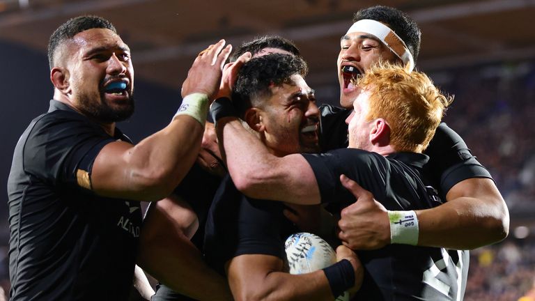 New Zealand's Richie Mo'unga is congratulated by teammates after scoring a try during the Rugby Championship test match between the All Blacks and South Africa at Mt Smart Stadium in Auckland, New Zealand, Saturday, July 15, 2023. ( Aaron Gillions/Photosport via AP)