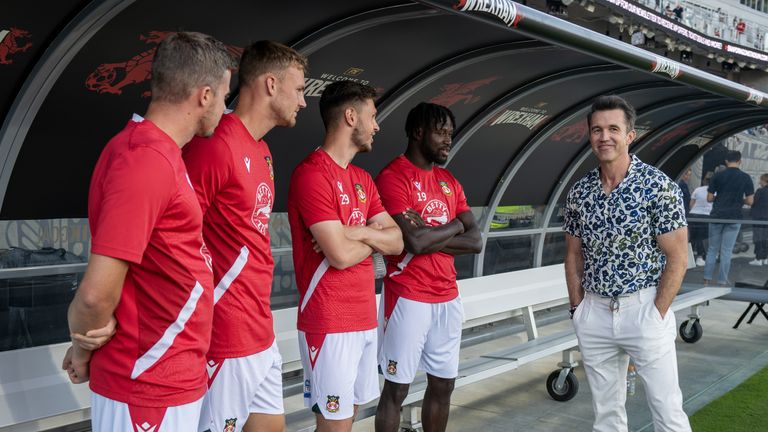 Wrexham owners Rob McElhenney meets the players ahead of the game