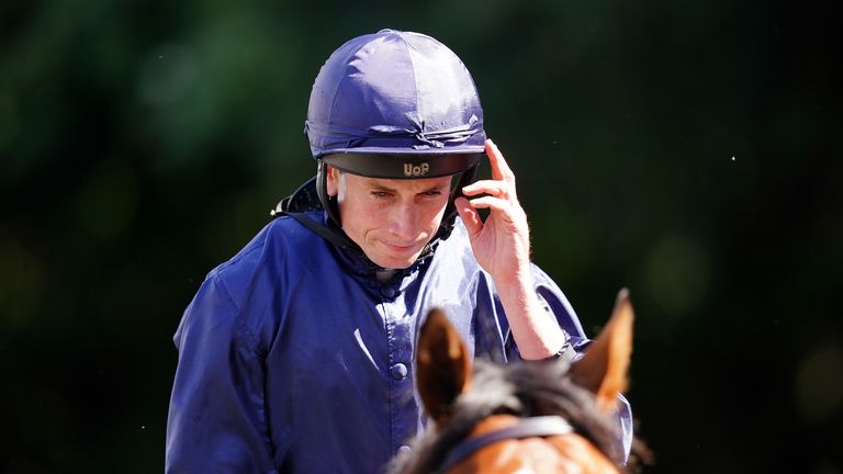 Ryan Moore takes in the adoration of the Newmarket crowd