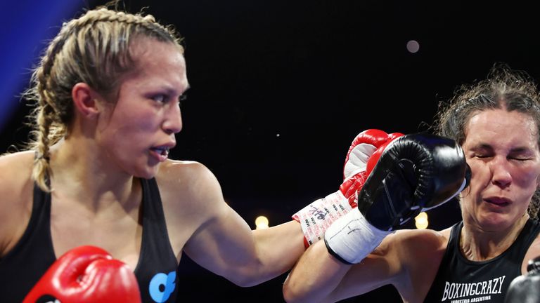 Seniesa Estrada, left, lands a punch against Jazmin Gala Villarino during the sixth round of a boxing bout in Las Vegas, Saturday, Nov. 12, 2022. (Erik Verduzco/Las Vegas Review-Journal via AP)