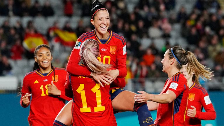 Spain's Jennifer Hermoso jumps into the arms of team-mate Alexia Putellas