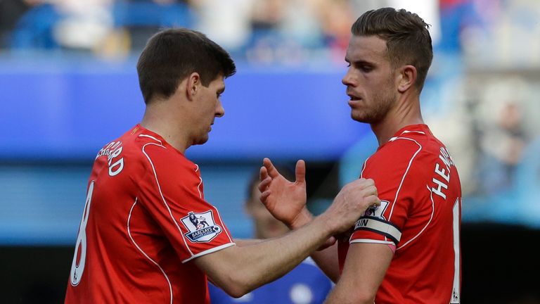 Liverpool&#39;s Steven Gerrard, left, hands the captains arm band to teammate Jordan Henderson as he turns to go off the pitch as he is substituted during their English Premier League soccer match between Chelsea and Liverpool at Stamford Bridge stadium in London, Sunday, May 10, 2015.