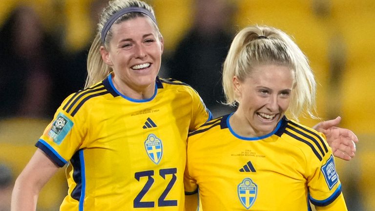 Sweden's Rebecka Blomqvist, right, celebrates with Sweden's Olivia Schough after scoring her side's 5th goal during the Women's World Cup Group G soccer match between the Sweden and Italy in Wellington, New Zealand, Saturday, July 29, 2023. (AP Photo/John Cowpland)