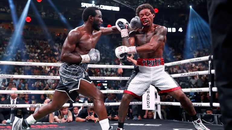 Terence Crawford, left, connects with a punch to Errol Spence Jr. during their welterweight title unification boxing bout Saturday, July 29, 2023, in Las Vegas. (Steve Marcus/Las Vegas Sun via AP)