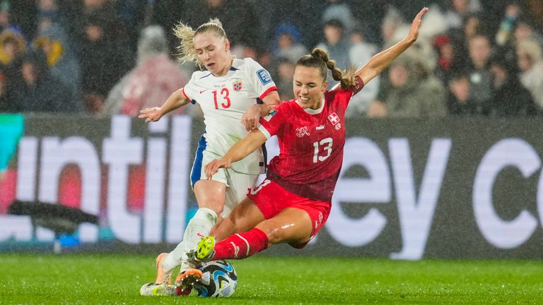 Norway's Thea Bjelde, left, battles for the ball with Switzerland's Lia Walti