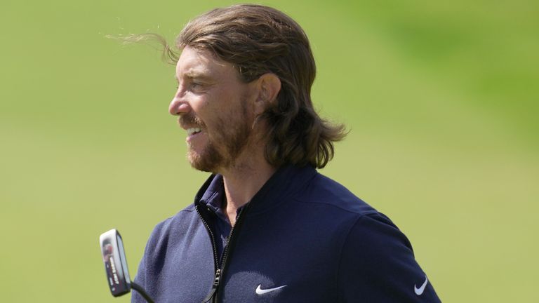 England's Tommy Fleetwood smiles after completing his 1st round on the 18th green on the first day of the British Open Golf Championships at the Royal Liverpool Golf Club in Hoylake, England, Thursday, July 20, 2023. (AP Photo/Kin Cheung)