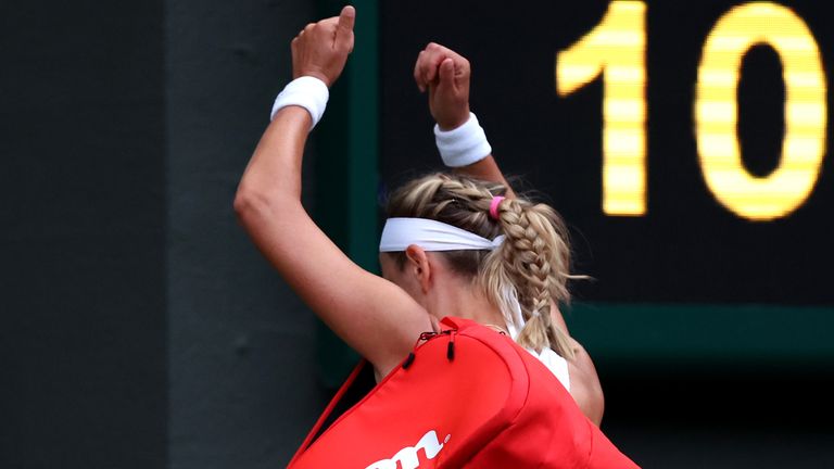 Azarenka banged her fists together as she walked off court