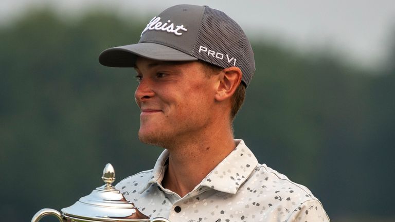 Vincent Norrman holds a trophy after winning the Barbasol Championship golf tournament at Keen Trace Gold Club in Nicholasville, Ky., on Sunday, July 16, 2023. (Ryan C. Hermens/Lexington Herald-Leader via AP)